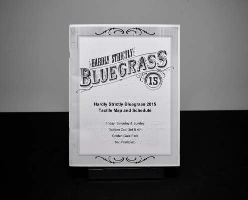 Cover for Hardly Strictly Bluegrass '15 map brochure, with braille and large print.